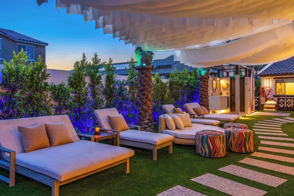 A one-of-a-kind outdoor lounge where custom floating shade sails create moving shade by day and a breathtaking atmosphere under the evening lights.
