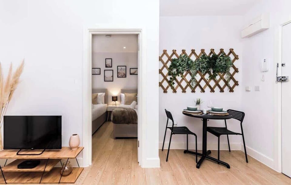 Stylish hallway leading to bedroom and charming dining nook
