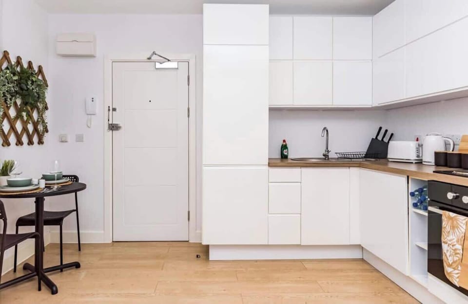 Clean entryway with storage and simple contemporary design elements
