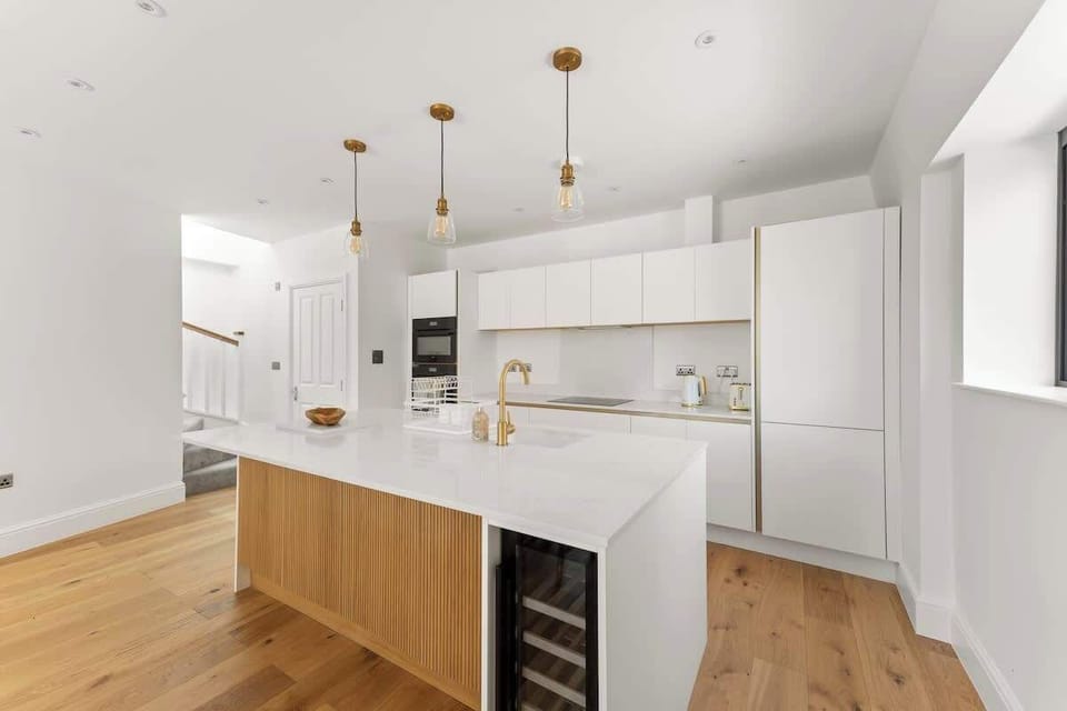 Contemporary kitchen island featuring sleek finishes and warm wood accents