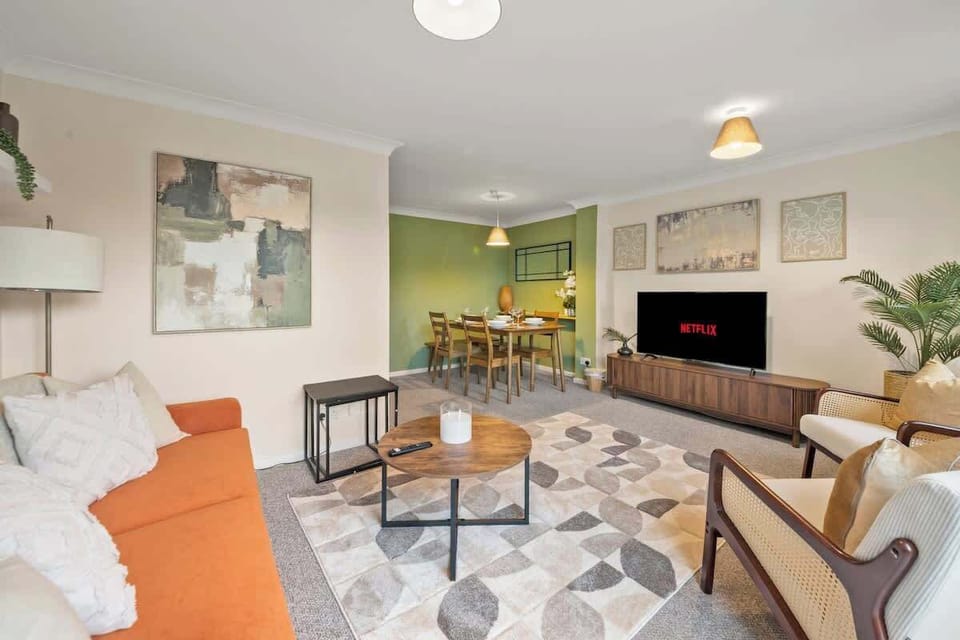 Spacious living room with fireplace contemporary furniture and cozy ambiance
