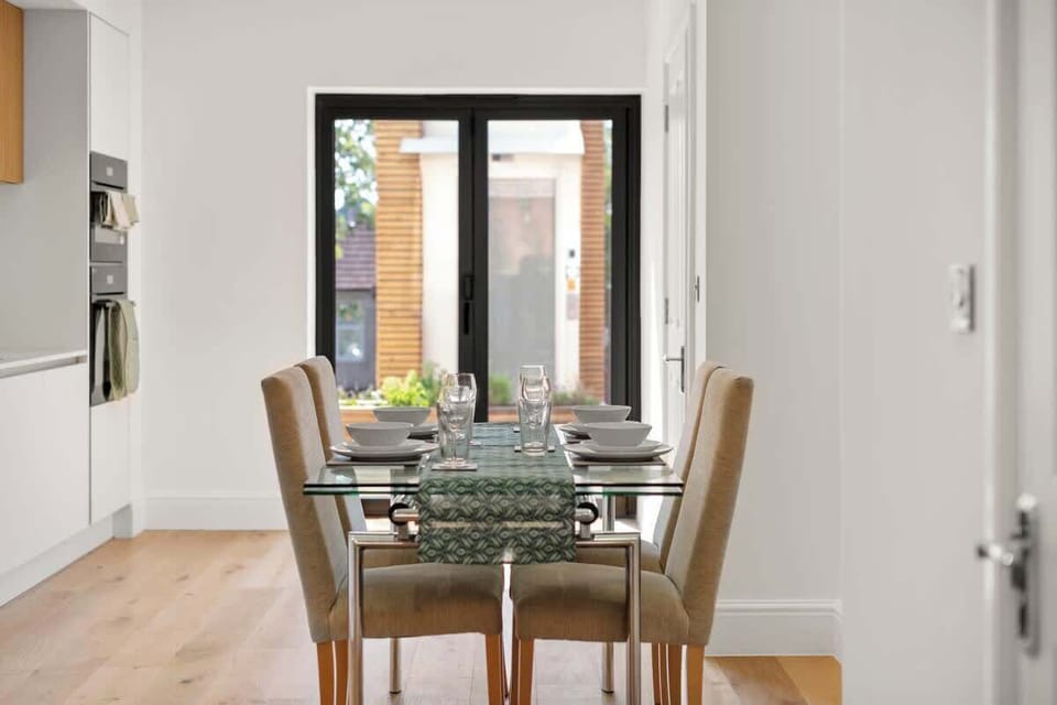 Dining space beside patio doors, perfect for meals and gatherings
