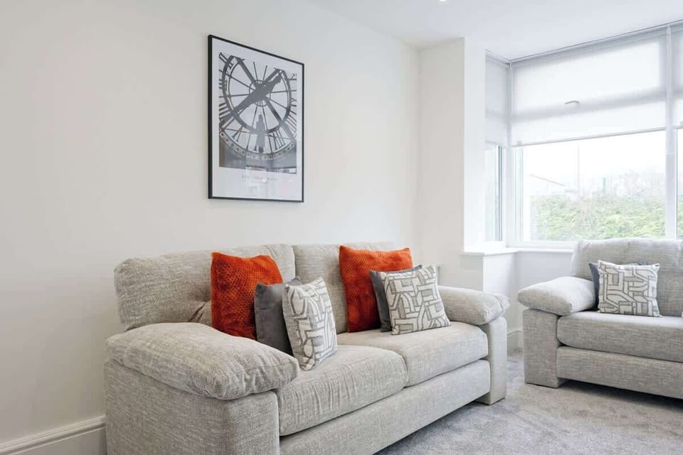 Cozy living room with plush sofa and vibrant accent cushions
