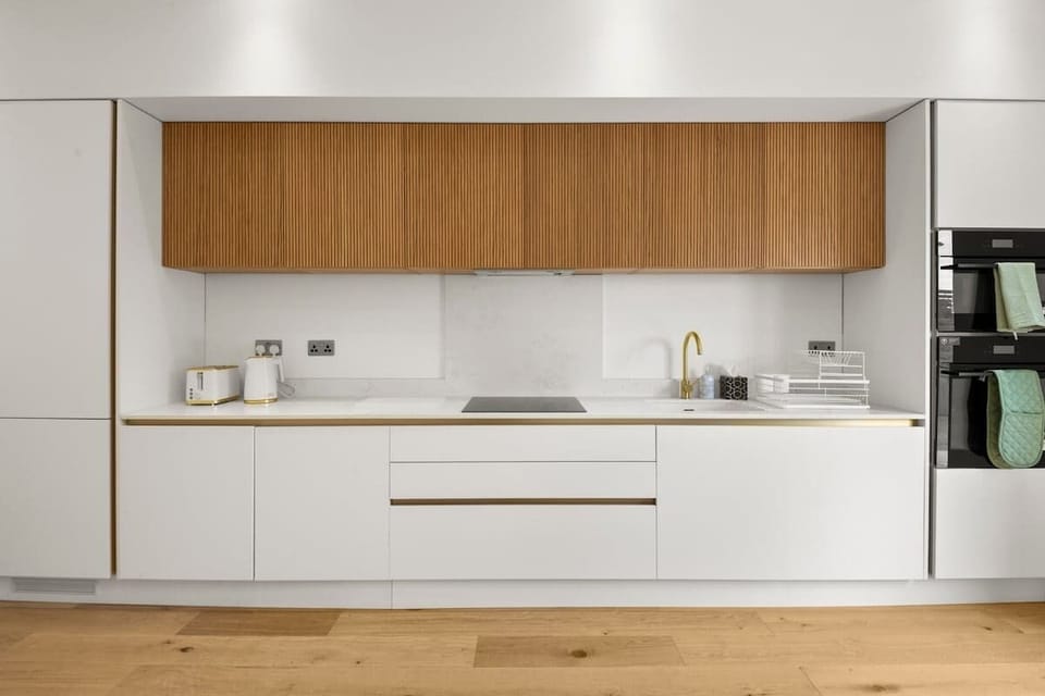 Modern kitchen design with sleek cabinetry and integrated appliances space