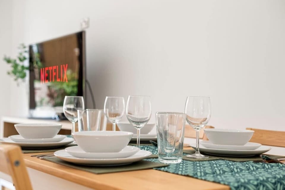 Dining table detail with wine glasses dishes and cozy ambiance