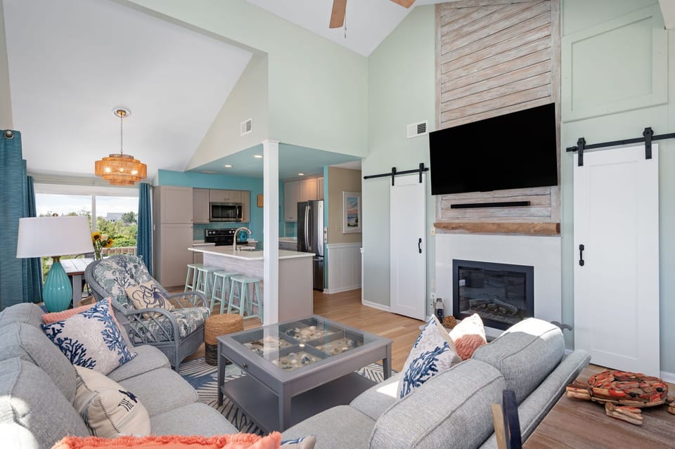 Great room with open concept floor plan, vaulted ceilings and updated kitchen.