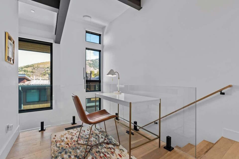Dedicated workspace with modern desk and comfortable seating
