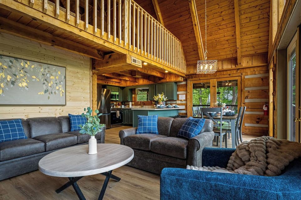 Warm wood tones, cozy textures, and a touch of modern charm—this inviting cabin living space is the perfect place to relax, unwind, and make memories surrounded by nature.
