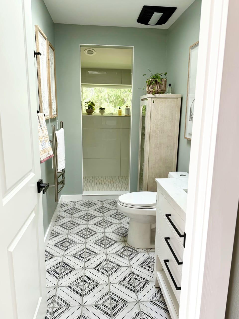 Brand new bath with walk in shower, towel warmer, heated floors, & Quince towels