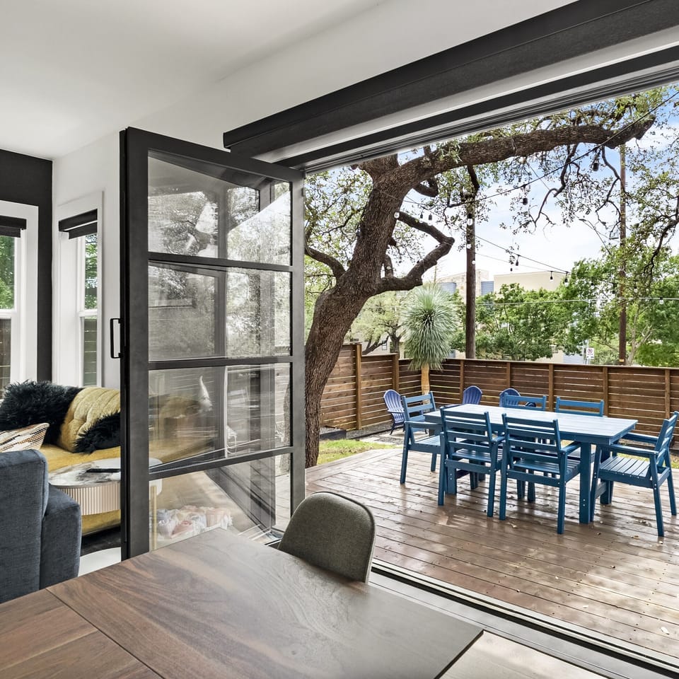 Seamless indoor-outdoor living with a shaded deck dining area