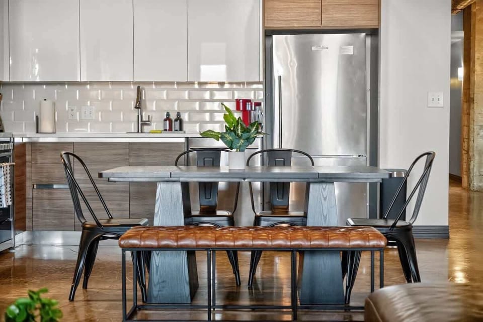 Modern Dining Area – A sleek dining setup with comfortable seating for your group, perfect for meals or game nights.