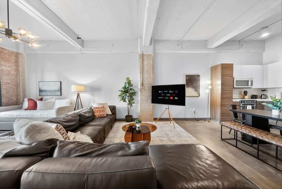 Seamless Flow – Modern kitchen meets cozy living space for a true open-concept experience.