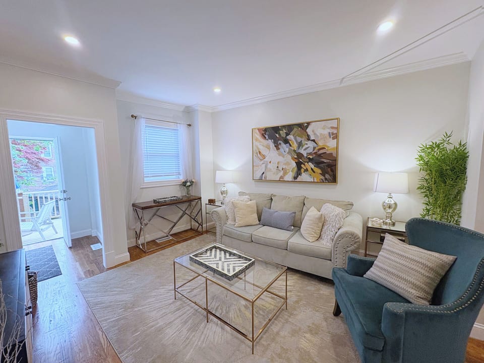 Cozy living area with elegant seating, warm hardwood floors