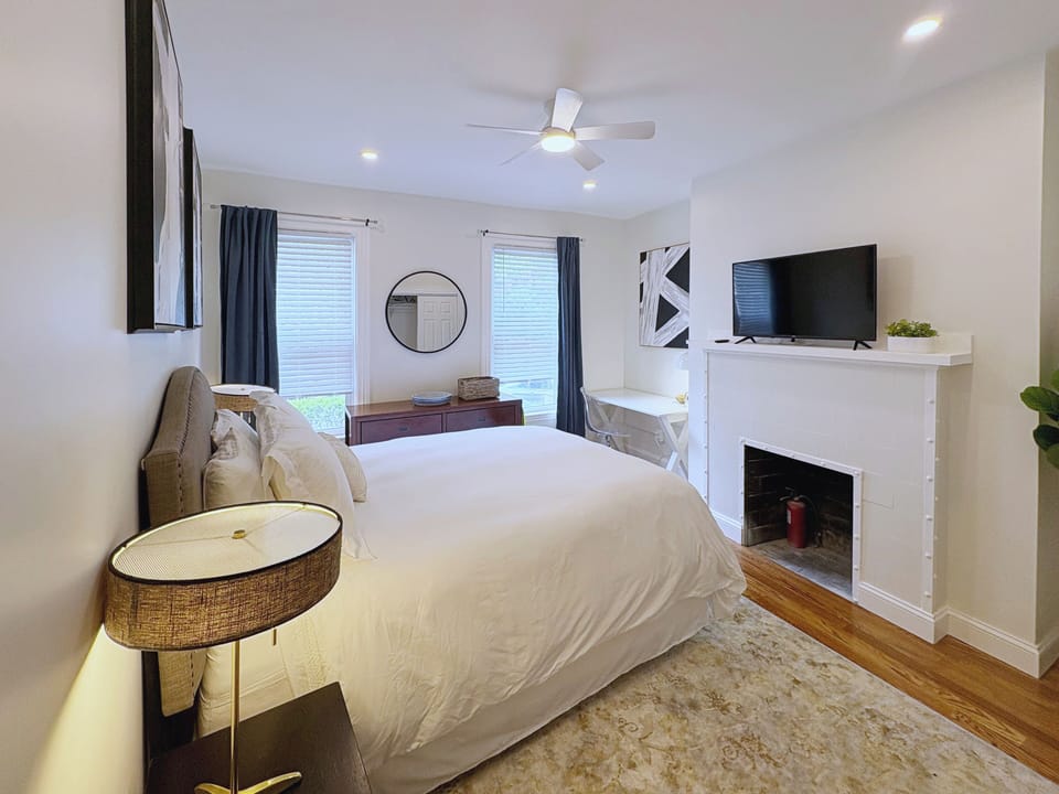 Relaxing bedroom with a comfortable bed, bedside lighting, ceiling fan