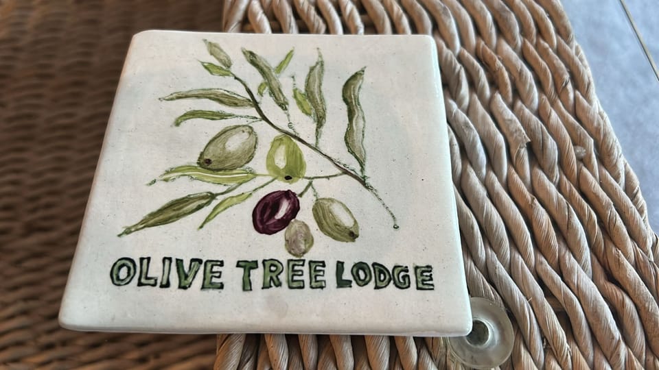 Personalised Olive Tree Lodge coasters included free.
