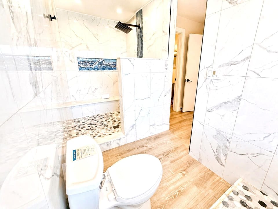 A well-appointed primary bathroom with a spa-like feel SOK-381