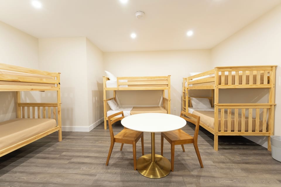 Your bright, welcoming bunk room awaits—perfect for families or groups, with space for everyone to unwind together around the cozy center table after a day of adventure.