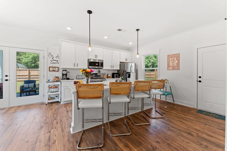 Open layout kitchen with a large island and plenty of spots to sit and have a bite to eat