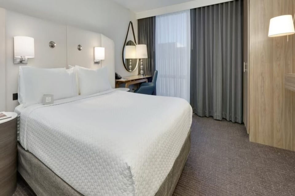 Settle in with crisp linens and a cozy work desk.