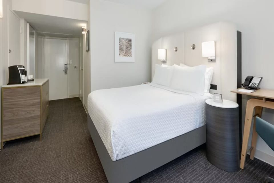 Refresh and recharge in a serene room with sleek finishes.