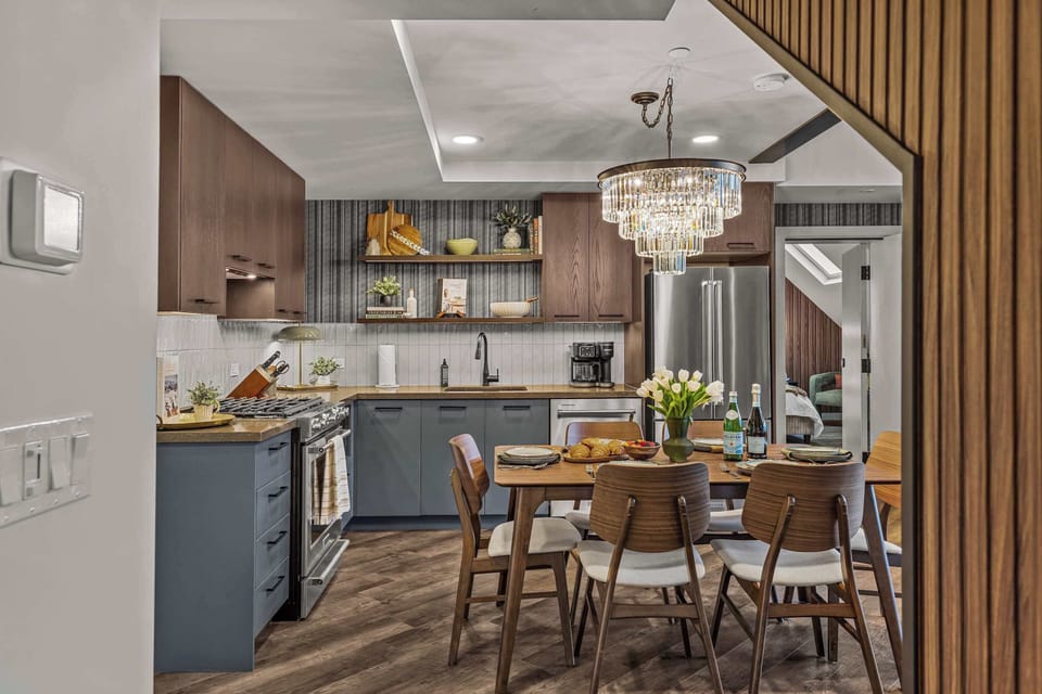Open fully furnished kitchen, dining table set at the heart of the kitchen. Cook while you sip and relax