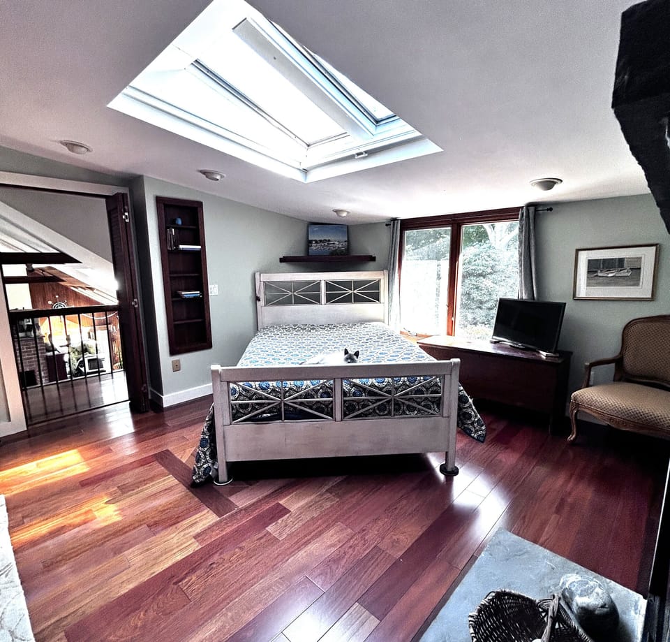Loft bedroom with comfortable queen bed