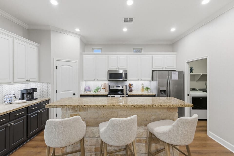 Enjoy morning coffee or extra dining space with the convenient bar stool seating.