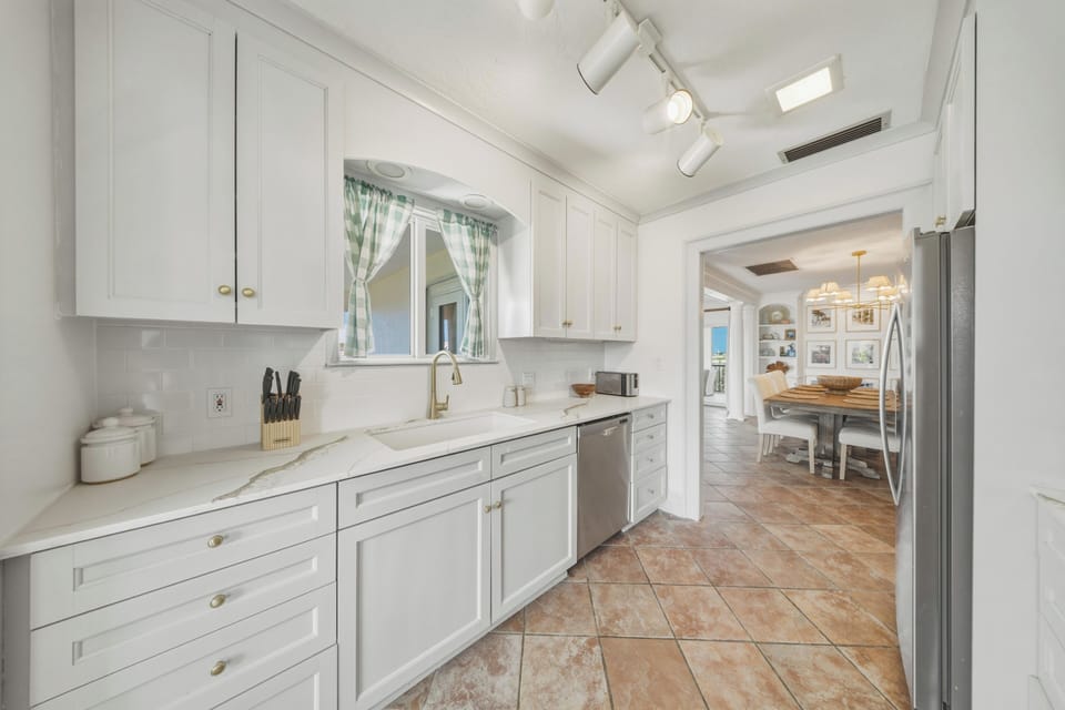 This galley-style kitchen offers generous counter space and everything needed to prepare meals with ease during your Marathon FL Florida Keys getaway.