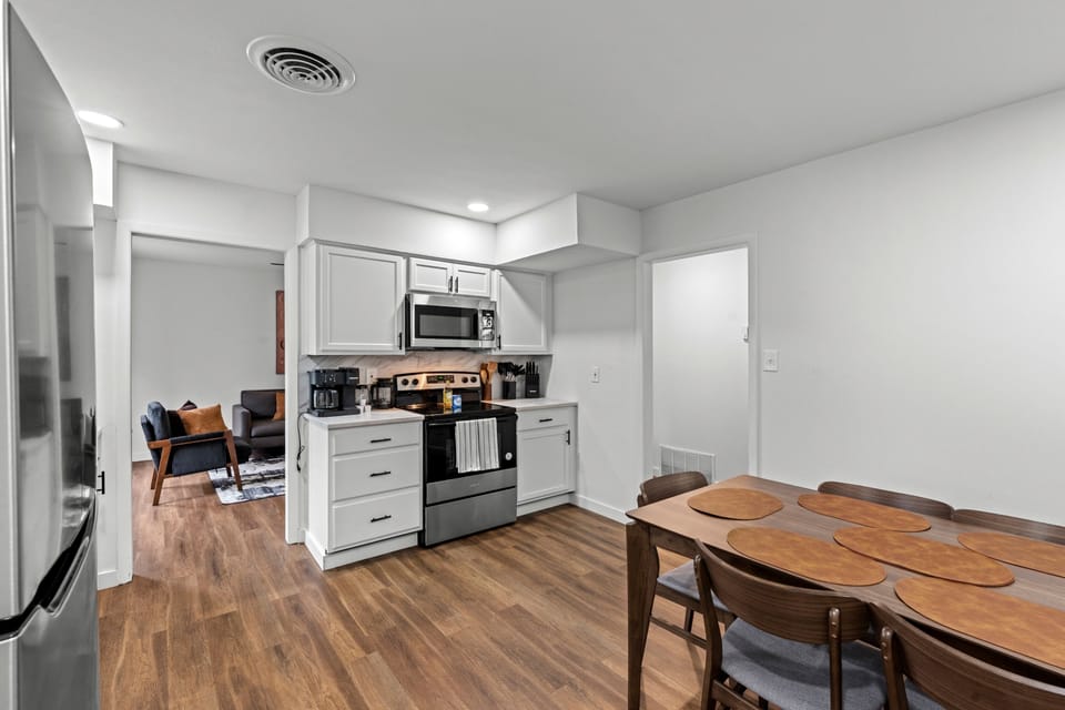 Clean, open kitchen and dining area with an easy flow—perfect for cooking and gathering together.