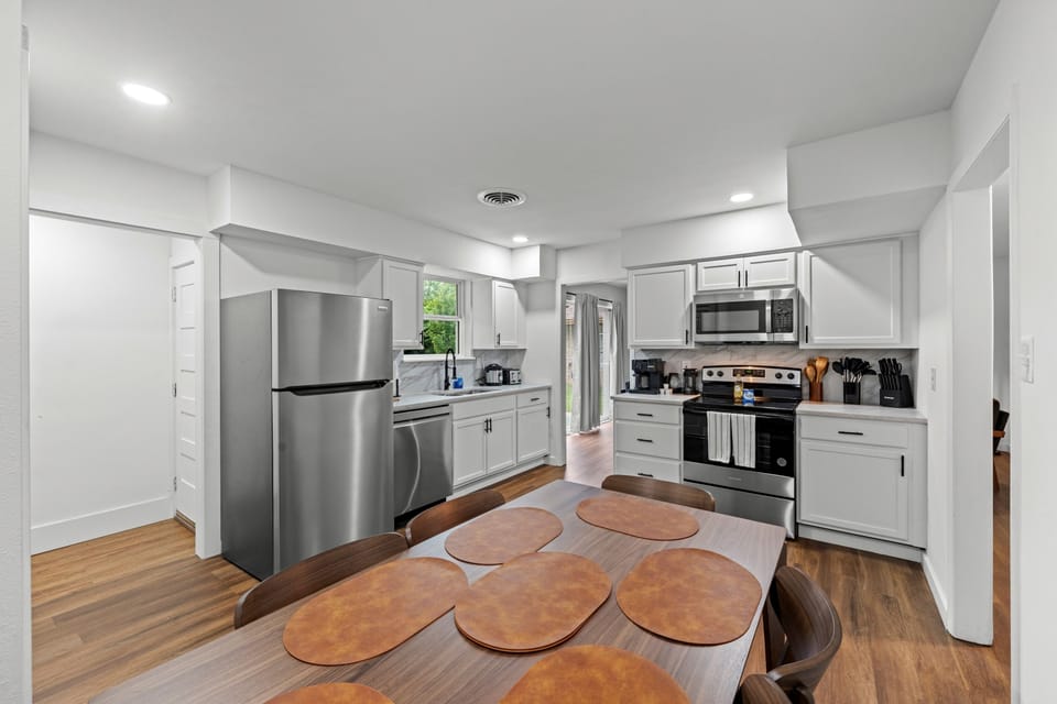 Bright, modern kitchen with a spacious dining area—perfect for easy meals and gathering together.