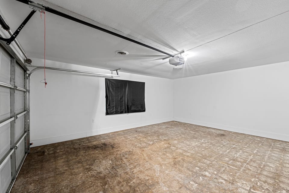 Spacious garage with plenty of room for parking or extra storage—secure and convenient.