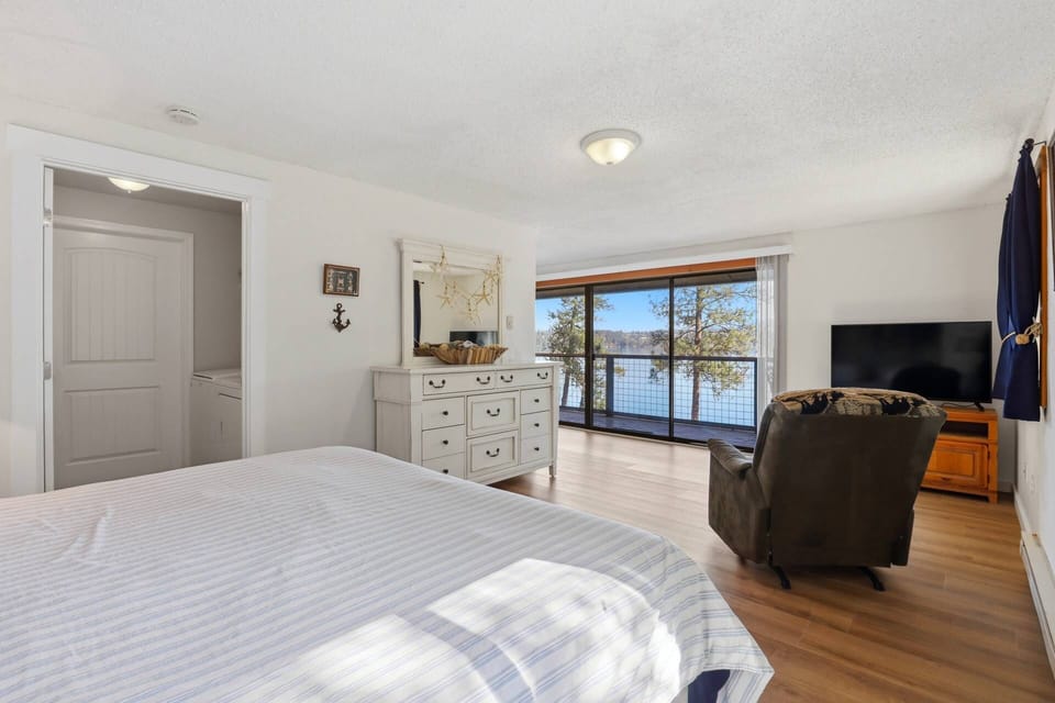 King-Size Bed Upstairs with attached Laundry Room and Closet