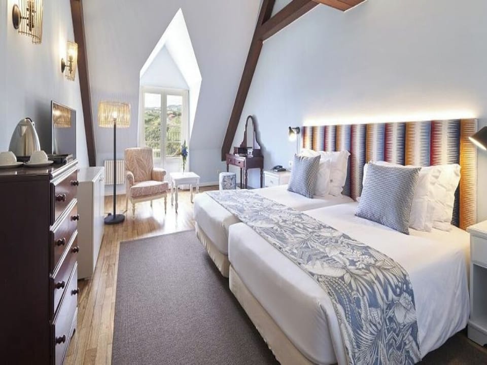 Stretch out in a lofty bedroom with serene, airy comfort.