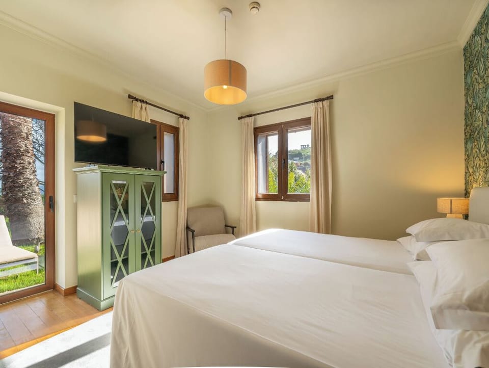Slip outside easily from this bright bedroom with garden access.
