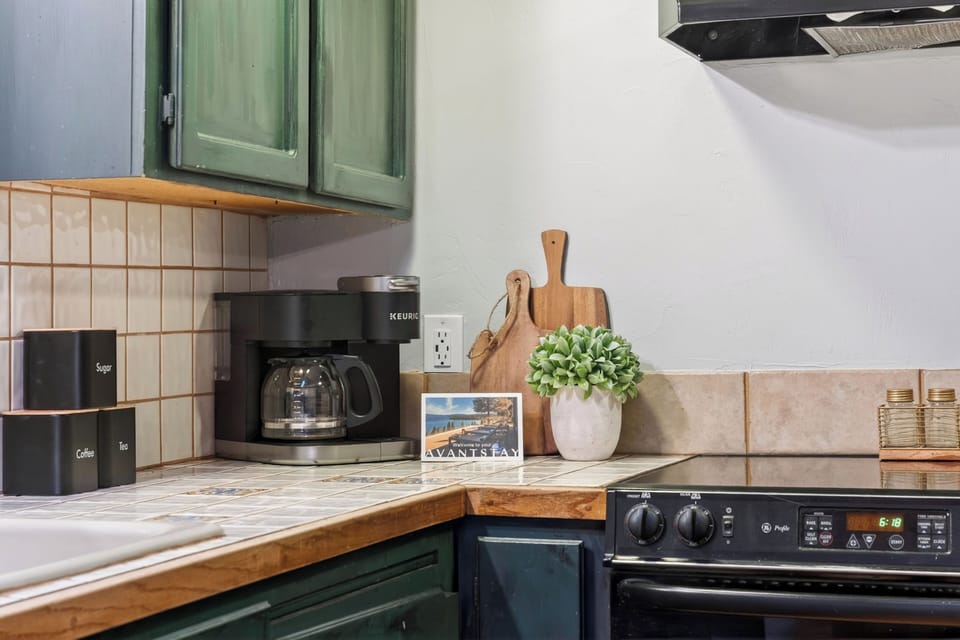 Fully equipped kitchen with stainless steel appliances and ample counter space.