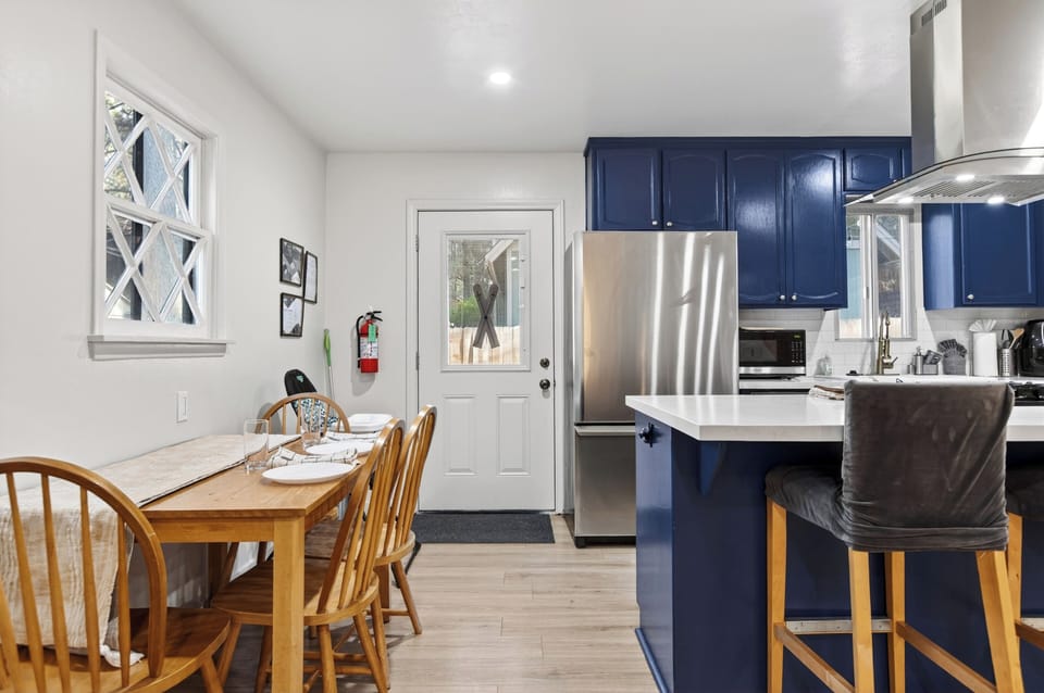 Enjoy easy meals and morning coffee in the bright dining area just steps from the fully equipped kitchen and breakfast bar.