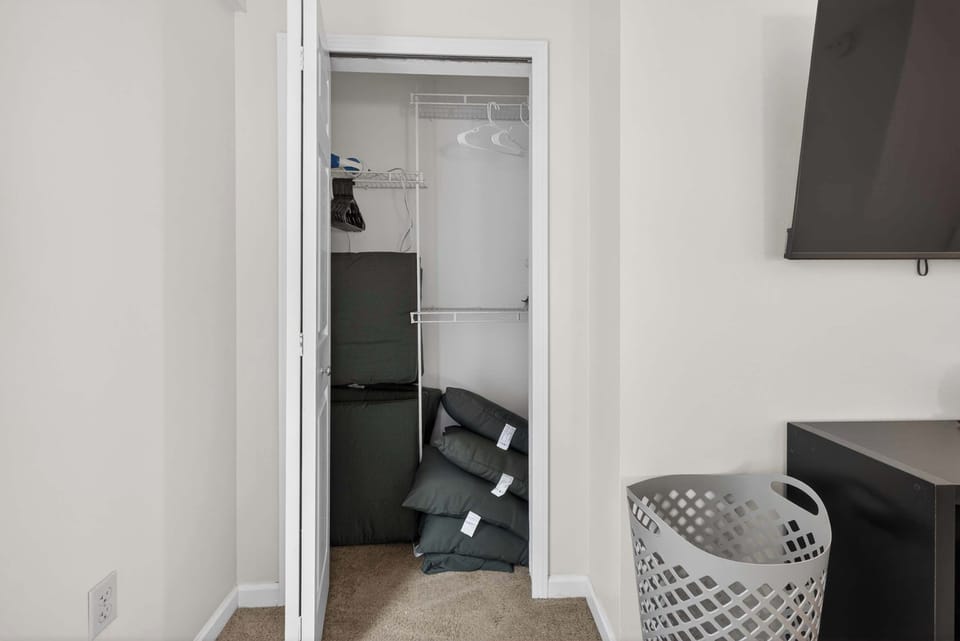 Open closet space w/ hangers & storage for easy unpacking during your stay