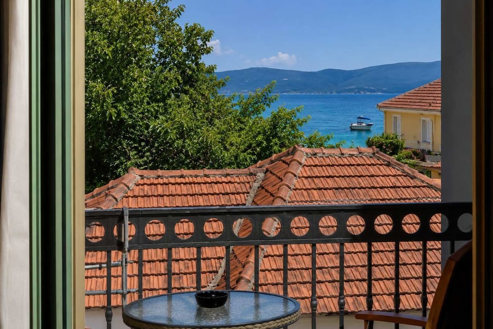 A balcony overlooking the village and the sea