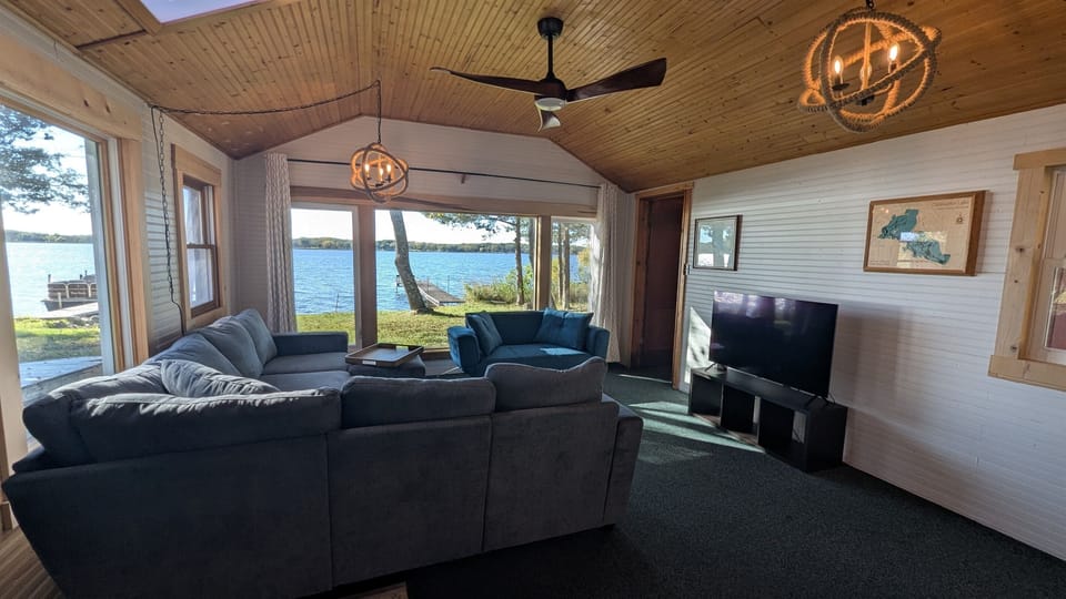 Living room with large lake view windows