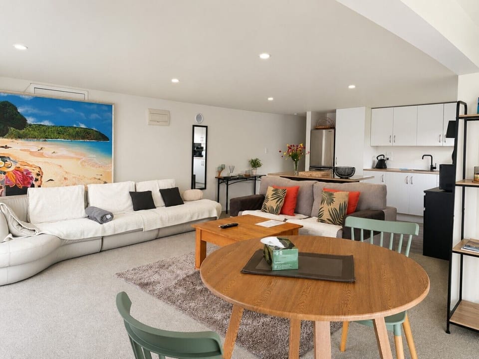 Modern coastal living room and kitchen with all the comforts