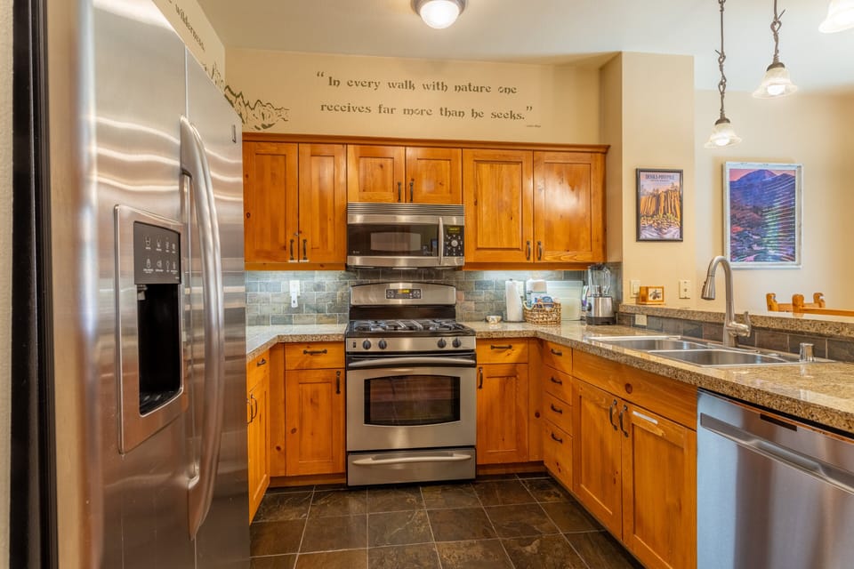 Kitchen has nice stainless steel appliances.
