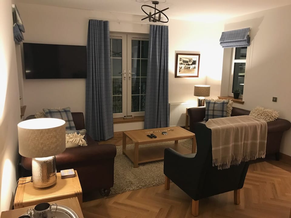 Living Room - 2 Tetrad leather sofas plus armchair. Large screen smart TV with full sports. Hi-Fi bluetooth speaker, mood lighting and blankets.