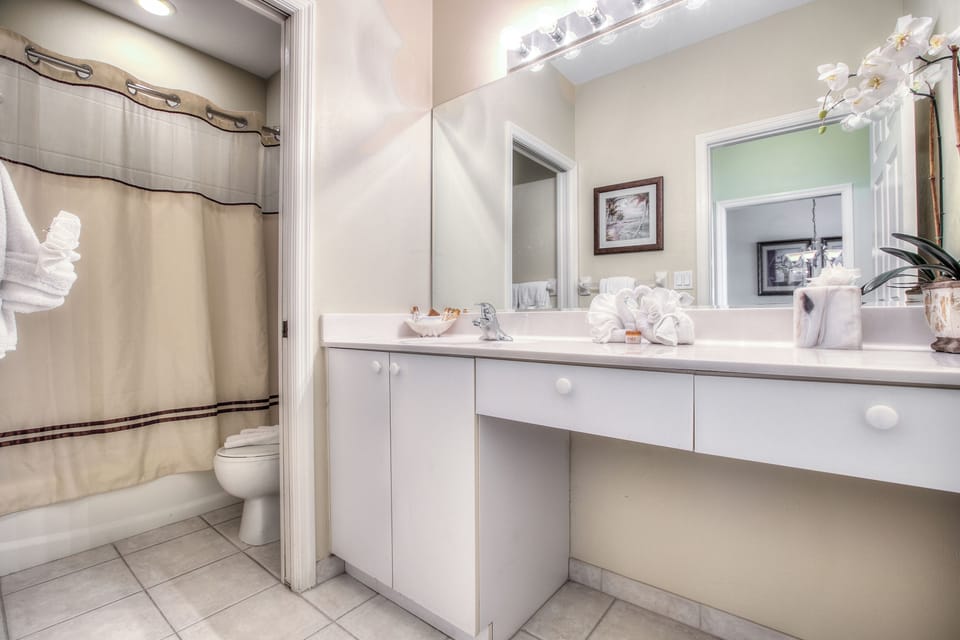 Refresh with fluffy towels and a clean, bright vanity.