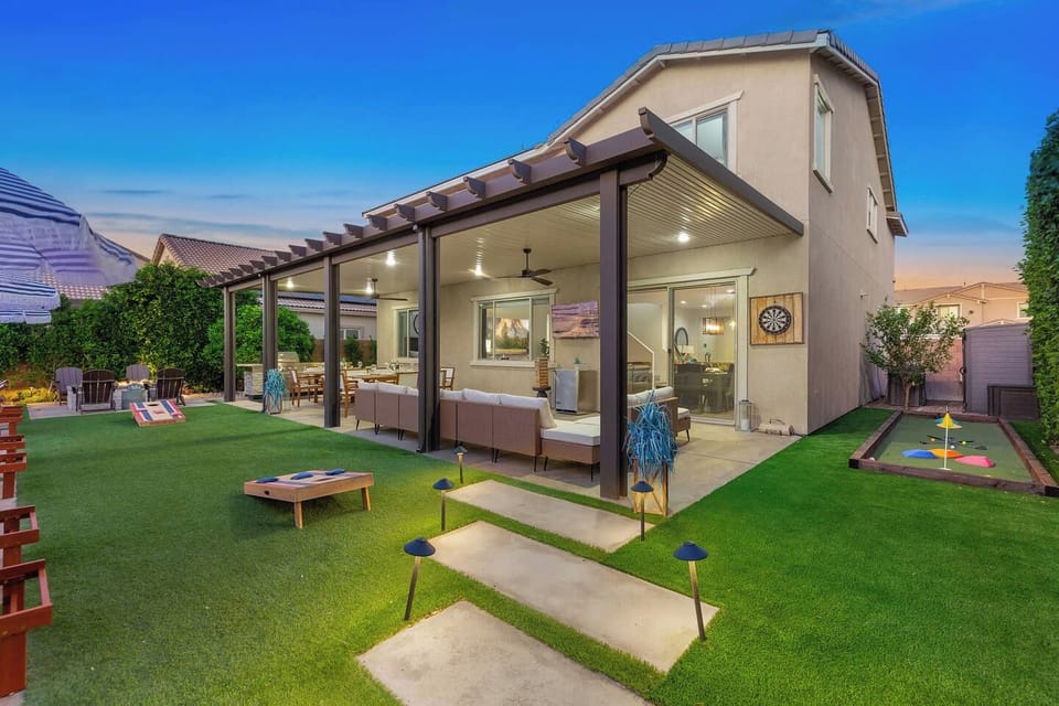 Relax on the patio and enjoy the beautifully landscaped lights that transform the evening