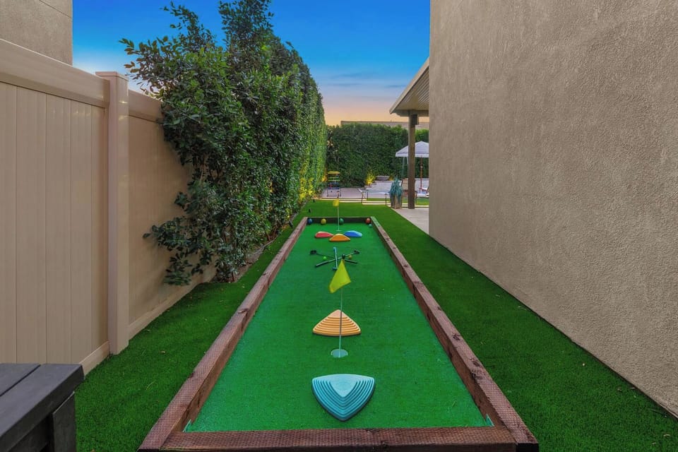 Unleash your competitive side on this versatile turf court, seamlessly transforming from a classic bocce ball setup to a customizable mini-golf course with endless obstacle challenges for the whole group!