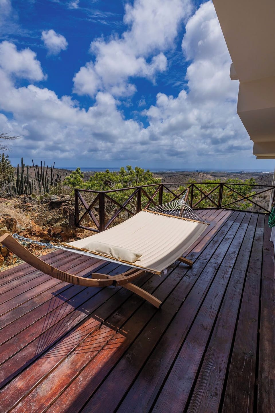 Relax on comfortable loungers while taking in panoramic hillside views