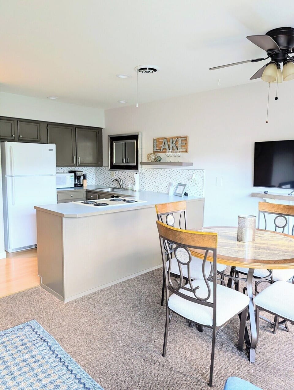 A full service kitchen stocked with essential pots, pans, plates, and more!