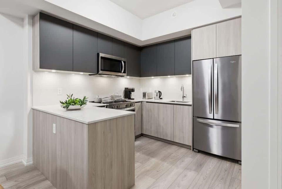 Modern kitchen with stainless steel appliances and sleek finishes