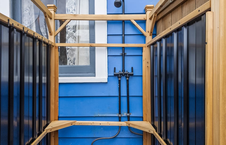 Backyard outdoor shower is perfect for rinsing off sand from the beach