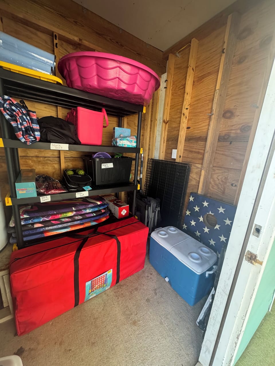 Shed w/beach toys, chairs, tent, boogie boards, wagon, large cooler, yard games 